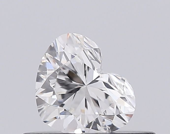 Heart-shaped diamond with brilliant cut facets, showcasing sparkle and clarity for engagement or luxury jewelry.