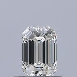 Emerald cut diamond with brilliant facets, showcasing clarity and sparkle against neutral background