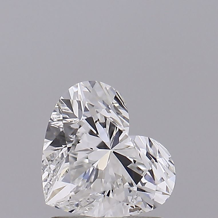 Heart-shaped diamond with brilliant cut, showcasing sparkle and clarity against neutral background
